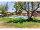 Enjoy lounging by the community pool on a sunny day, surrounded by lush greenery at 8532 E Portland St, Scottsdale, AZ 85257
