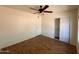 Bedroom featuring hard wood floors, neutral walls, a ceiling fan, and a closet at 9402 N 48Th Dr, Glendale, AZ 85302