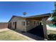 Back exterior of home with patio, yard and sparkling pool at 9402 N 48Th Dr, Glendale, AZ 85302