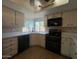 Bright eat-in kitchen features tile flooring, white cabinets, and updated appliances at 9402 N 48Th Dr, Glendale, AZ 85302