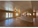Open living room with tile flooring, recessed lighting, and seamless flow into the backyard pool area at 9402 N 48Th Dr, Glendale, AZ 85302