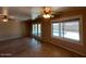 Bright living room featuring neutral walls, tile floors, and a view of the pool at 9402 N 48Th Dr, Glendale, AZ 85302