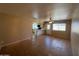 Open living room showcasing tile floors, natural lighting, and access to the kitchen area at 9402 N 48Th Dr, Glendale, AZ 85302