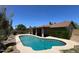 View of a private backyard pool with desert landscaping and ample deck space at 9402 N 48Th Dr, Glendale, AZ 85302