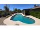 Backyard view of a kidney-shaped pool with plenty of room for entertaining at 9402 N 48Th Dr, Glendale, AZ 85302