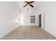 Bedroom featuring carpet flooring, ceiling fan, windows and a closet at 11358 E Jenan Dr, Scottsdale, AZ 85259
