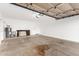 Spacious two car garage with water heater and white walls at 11358 E Jenan Dr, Scottsdale, AZ 85259
