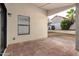 Cozy covered patio featuring tile flooring and access to a well-maintained backyard at 11358 E Jenan Dr, Scottsdale, AZ 85259