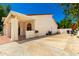 Exterior view of the home with a covered patio, side yard, and AC Unit at 119 E Palomino Dr, Tempe, AZ 85284