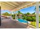 Balcony with a view of the sparkling pool and lush greenery at 119 E Palomino Dr, Tempe, AZ 85284