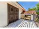 Exterior balcony with protective iron door and tiled roof at 119 E Palomino Dr, Tempe, AZ 85284