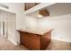 A custom bar area, perfect for entertaining, featuring a tile countertop and a convenient footrest at 119 E Palomino Dr, Tempe, AZ 85284
