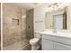 Updated bathroom boasts a tile shower, modern fixtures, and a stylish vanity at 119 E Palomino Dr, Tempe, AZ 85284