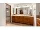 Bathroom vanity features double sinks, wood cabinets, and bright vanity lights at 119 E Palomino Dr, Tempe, AZ 85284