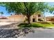 Stunning two-story home with a Spanish tile roof, a three-car garage, and mature landscaping at 119 E Palomino Dr, Tempe, AZ 85284