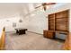 Spacious game room with a pool table, built-in desk, ceiling fan, and ample natural light at 119 E Palomino Dr, Tempe, AZ 85284