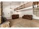 Large living room featuring an open-concept floor plan and a unique spiral staircase to the second floor at 119 E Palomino Dr, Tempe, AZ 85284