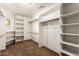Walk-in closet features built-in shelving and ample storage space at 119 E Palomino Dr, Tempe, AZ 85284