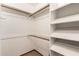 Bright walk-in closet features carpet, shelving, and hanging storage at 119 E Palomino Dr, Tempe, AZ 85284