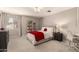 Cozy bedroom with a comfortable bed, bedside table, and a decorative bookshelf at 1343 E Amberwood Dr, Phoenix, AZ 85048