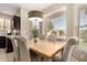 Eat in Kitchen dining area featuring multiple windows showcasing mountain views and a modern chandelier at 1343 E Amberwood Dr, Phoenix, AZ 85048