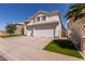 Charming two-story home with a three-car garage and well-manicured lawn at 1343 E Amberwood Dr, Phoenix, AZ 85048