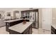 Open kitchen featuring an island, stainless appliances, and ample counter space, great for entertaining at 1343 E Amberwood Dr, Phoenix, AZ 85048