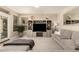 Spacious living room featuring a large sectional sofa and neutral decor at 1343 E Amberwood Dr, Phoenix, AZ 85048