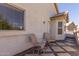 Covered patio with tiled flooring, seating area, and ample natural light, perfect for outdoor relaxation at 1343 E Amberwood Dr, Phoenix, AZ 85048