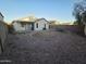 Spacious backyard surrounded with a block fence and covered patio perfect for outdoor living at 13606 N 130Th Ave, El Mirage, AZ 85335