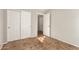 Neutral bedroom with closet doors and neutral tile floor at 1381 W Gary Dr, Chandler, AZ 85224
