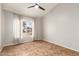 Neutral bedroom with window, high ceilings, and neutral tile floors at 1381 W Gary Dr, Chandler, AZ 85224