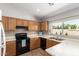 Functional kitchen with laminate countertops, tiled backsplash, and essential appliances for everyday cooking at 1381 W Gary Dr, Chandler, AZ 85224