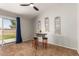Cozy living area with a ceiling fan, sliding glass doors to the backyard, and decorative wall art at 1381 W Gary Dr, Chandler, AZ 85224