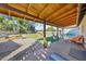 Inviting covered patio with hammocks, swing set, and pool access, perfect for outdoor relaxation and entertainment at 14221 N 43Rd St, Phoenix, AZ 85032