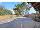 Spacious backyard sports court complete with a basketball hoop and a workout area for fitness enthusiasts at 14221 N 43Rd St, Phoenix, AZ 85032