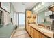 Bright bathroom with dual sinks, granite countertops, and a glass-enclosed shower at 14221 N 43Rd St, Phoenix, AZ 85032