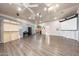 Expansive bonus room features laminate flooring, a projector screen, and natural light at 14221 N 43Rd St, Phoenix, AZ 85032