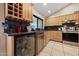 Well-appointed kitchen features granite countertops, wooden cabinets, and modern stainless steel appliances at 14221 N 43Rd St, Phoenix, AZ 85032
