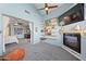 Cozy living room features a fireplace, built in shelving, and easy access to the main bedroom at 14221 N 43Rd St, Phoenix, AZ 85032