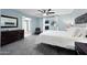 Serene bedroom with soft blue walls, plush carpet, and a cozy fireplace nook at 14221 N 43Rd St, Phoenix, AZ 85032