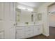 Bright Primary bathroom with double sinks, modern fixtures, and large mirrors for added appeal at 14719 N 176Th Ave, Surprise, AZ 85388