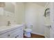 A clean half bathroom shows a floating vanity with modern fixtures, and an open decorative shelf at 14719 N 176Th Ave, Surprise, AZ 85388