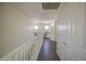 A hallway leading to a study area features a white banister and warm, neutral wall colors at 14719 N 176Th Ave, Surprise, AZ 85388