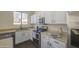 Clean kitchen featuring stainless steel appliances, white cabinets, and granite countertops at 14719 N 176Th Ave, Surprise, AZ 85388