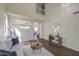 Bright living room featuring neutral walls, high ceilings, wood floors, and a modern chandelier at 14719 N 176Th Ave, Surprise, AZ 85388