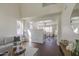 Bright living room featuring wood floors, neutral-toned furniture, high ceilings, and lots of light at 14719 N 176Th Ave, Surprise, AZ 85388