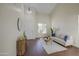 Open-concept living area with wood floors, a chandelier, neutral walls, and ample natural light at 14719 N 176Th Ave, Surprise, AZ 85388