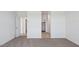 Bright bedroom features carpet flooring, white walls, and an open door at 1534 E Mason Dr, Casa Grande, AZ 85122
