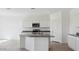 Bright kitchen features white cabinets, granite countertops and stainless steel appliances at 1534 E Mason Dr, Casa Grande, AZ 85122